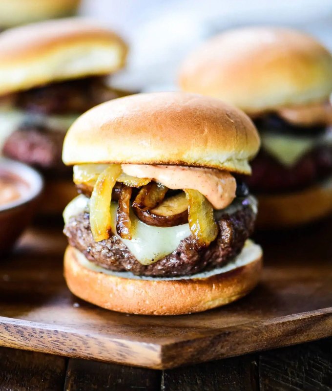 best burger recipes: mushroom swiss slider burgers on a cutting board