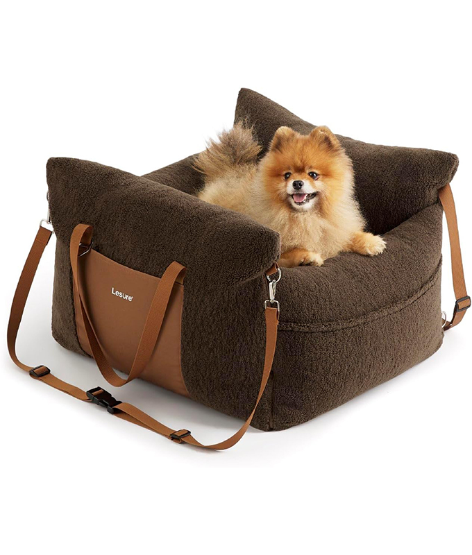 best-dog-car-seat: a small dog sitting in a brown dog car seat.