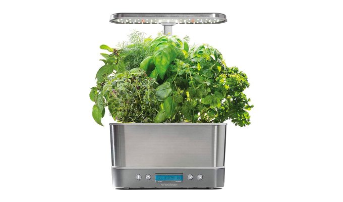 best-gardening-gifts: A gardening box with a lamp and other gadgets for growth in front of a white background.