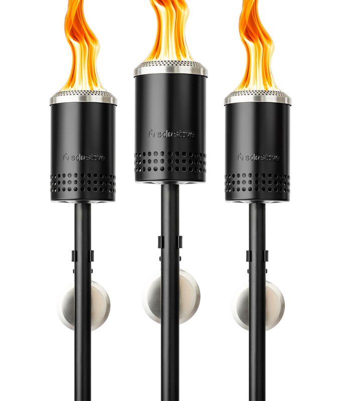 best-gardening-gifts: Three Solo Stove torches that are lit with flames.
