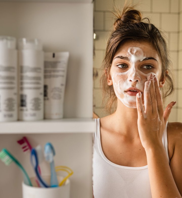 best skincare for teens a photo of a teen washing her face