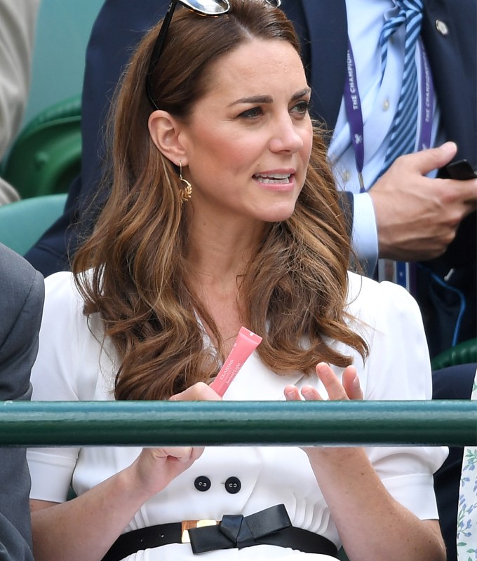Kate Middleton holding the Clarins Lip Perfector Shimmer Lip Gloss.