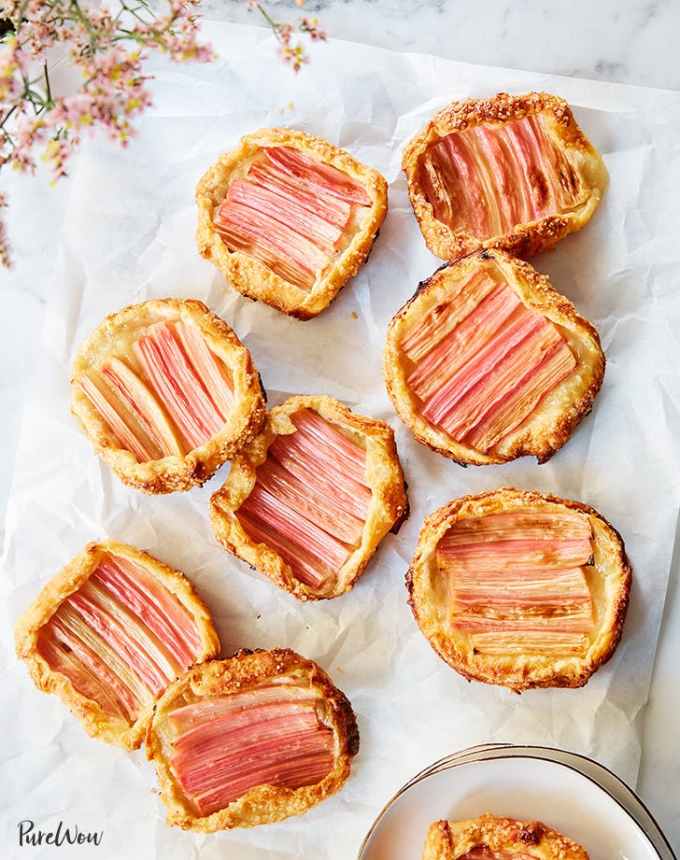 fun things to bake: nine mini rhubarb galettes on a sheet of parchment