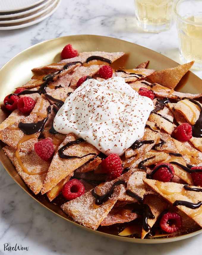 fun things to bake: plate of dessert nachos topped with raspberries and whipped cream