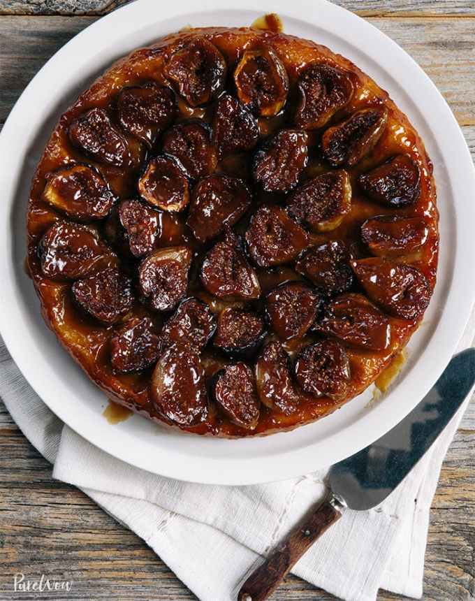 fun things to bake: aerial of fig tarte tatin on a plate, atop a white linen
