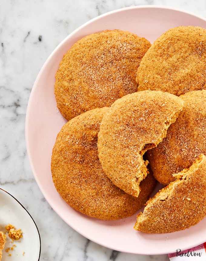 fun things to bake: aerial of a pink plate of giant snickerdoodles with one split in half