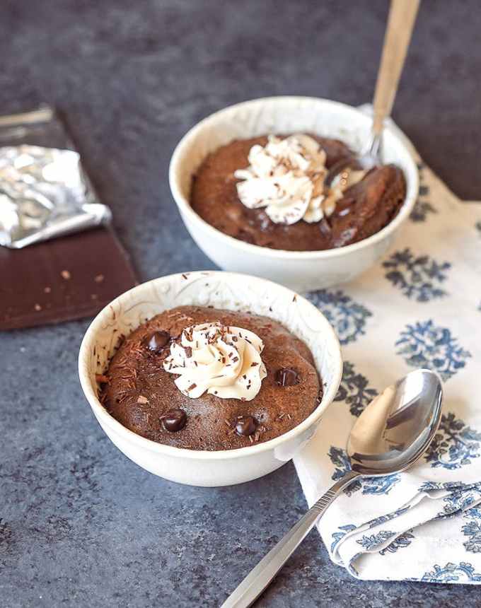 fun things to bake: two microwave double chocolate cake bowls with spoons and whipped cream