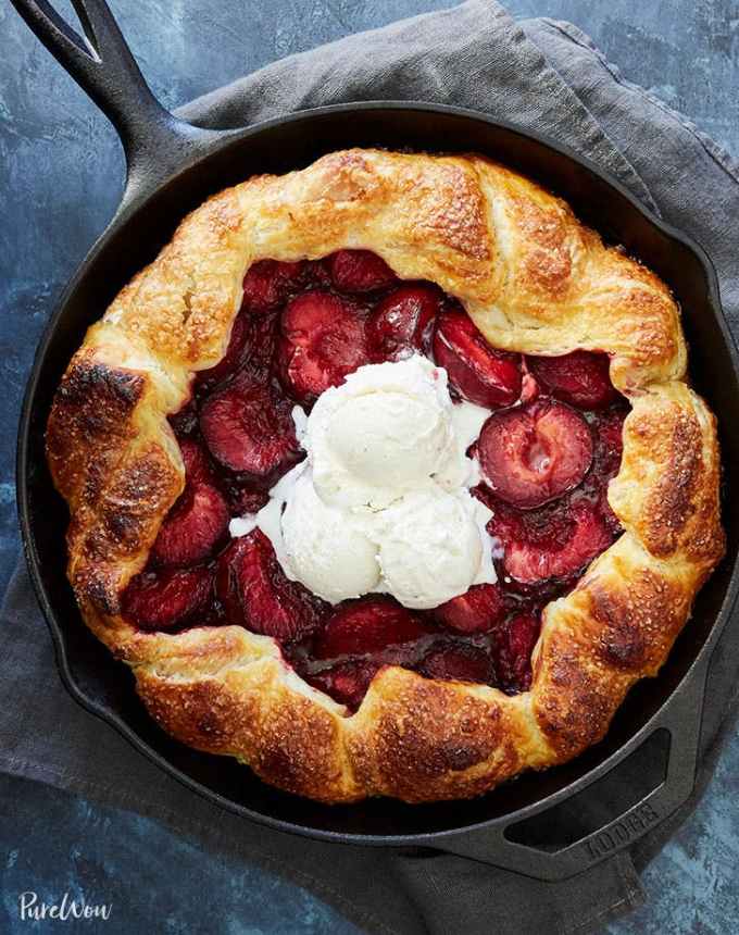 fun things to bake: aerial of puff pastry plum galette in a cast iron skillet