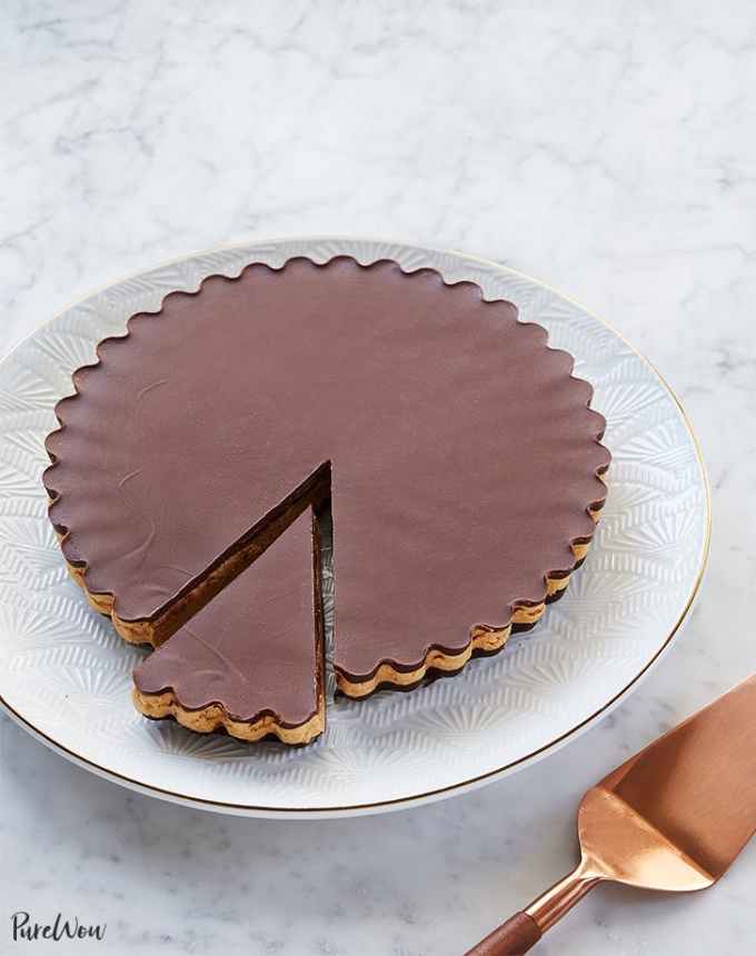fun things to bake: large peanut butter cup on a plate with a slice cut into