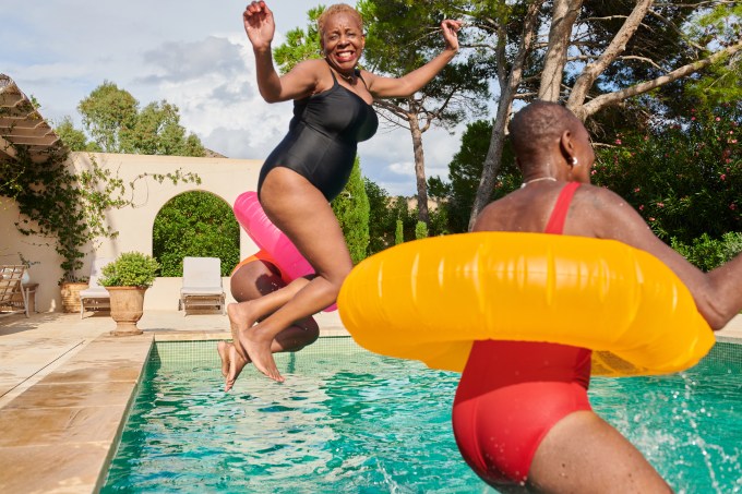 what signals the end of menopause happy older women jumping into a pool